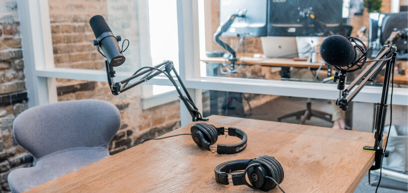 empty podcast room with microphone and headphones - Podcast header - insights page