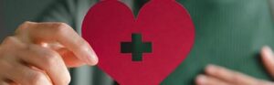 hand holding a paper heart - Brady Ware - SRC Nonprofit Organizations