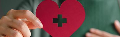 hand holding a paper heart - Brady Ware - SRC Nonprofit Organizations